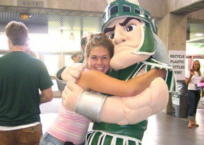 Amber hugging Sparty at Michigan State