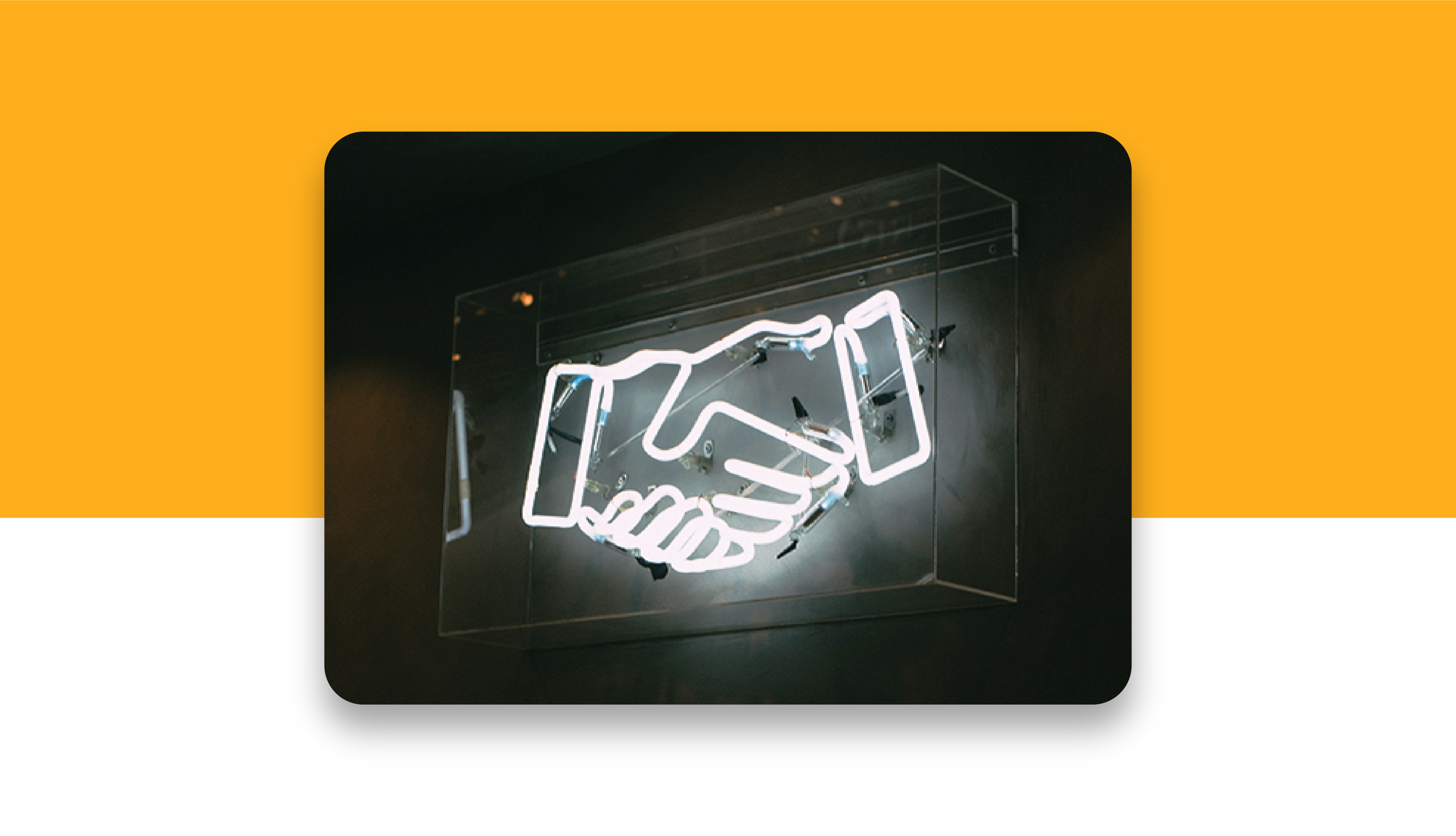 Neon sign displaying a hand shake with a yellow block of color in the background