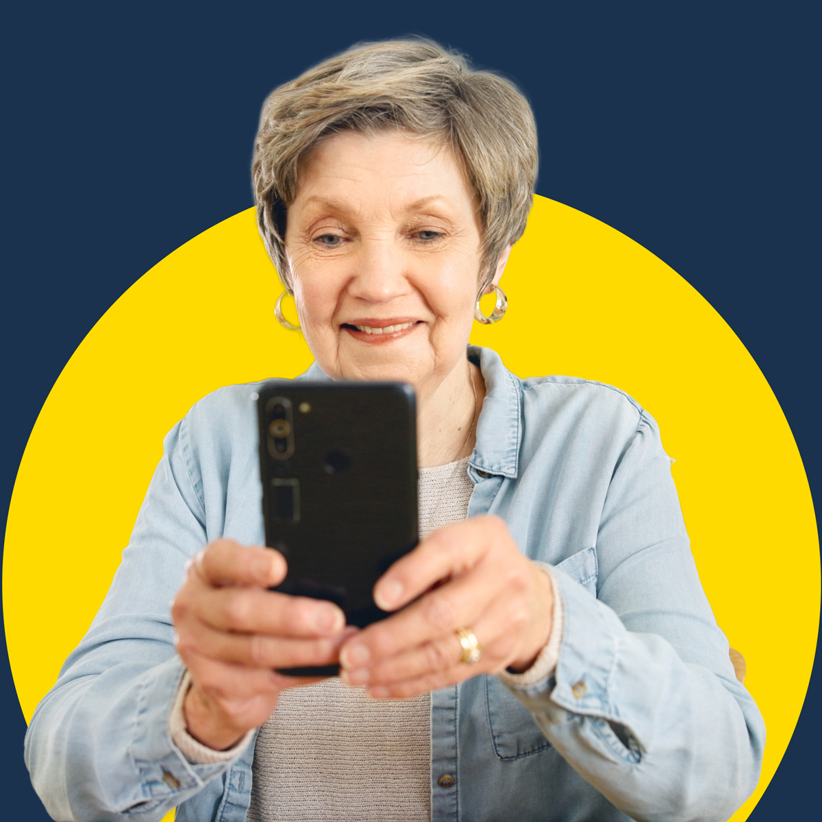 a senior woman using a mobile phone on a blue background with a yellow circle behind her